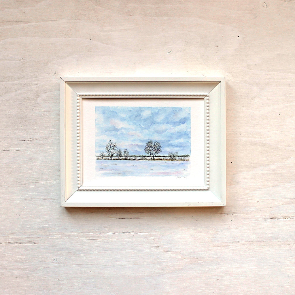 Print of watercolor painting depicting a wintry rural field by artist Kathleen Maunder