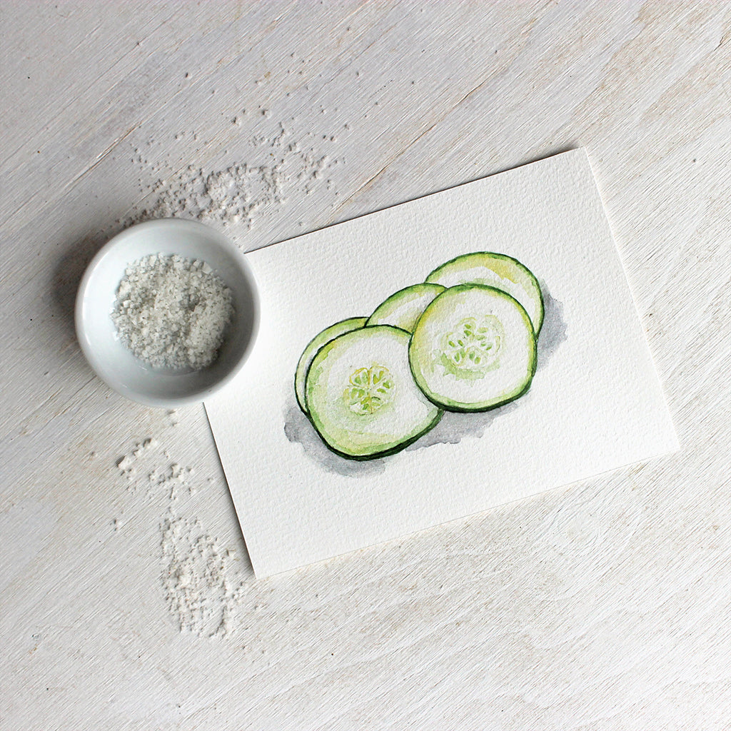 Art print of a watercolor painting of fresh cucumber slices. Artist Kathleen Maunder