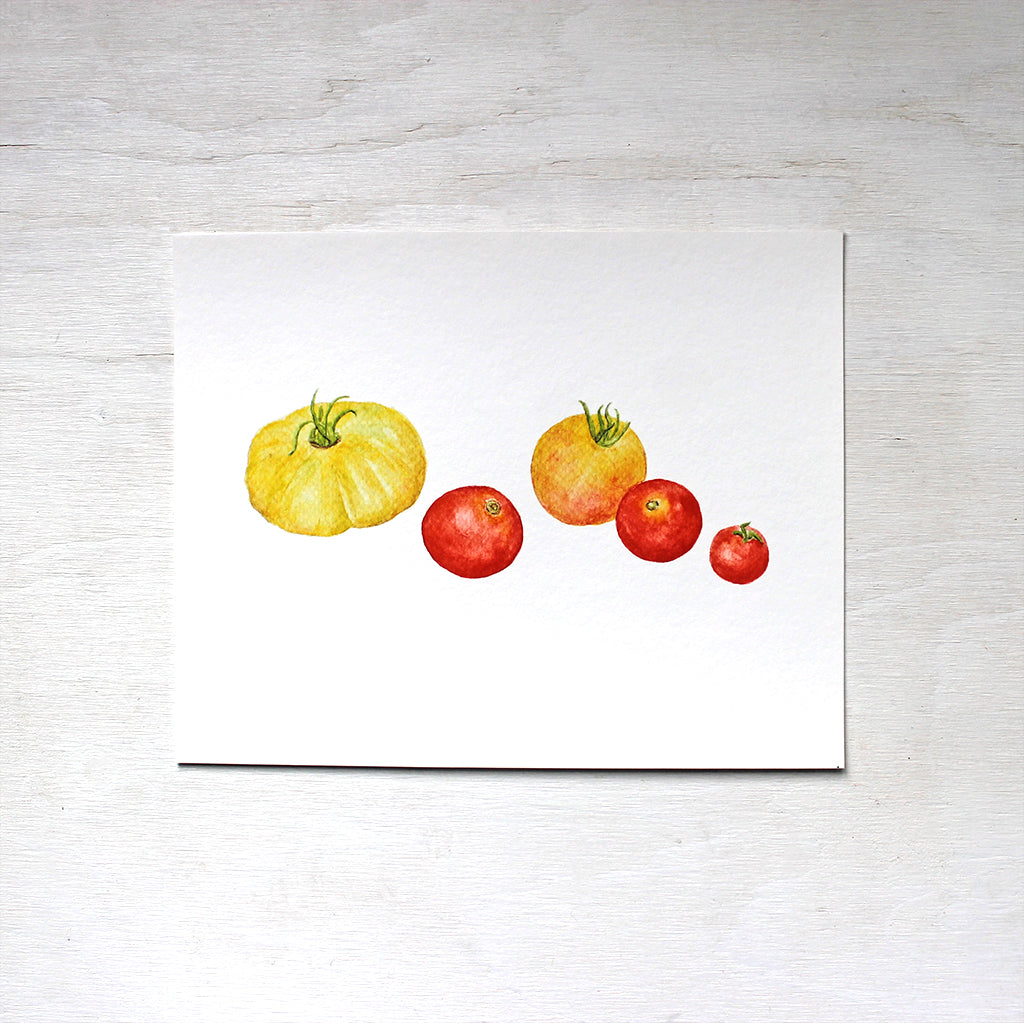 An art print of yellow and red heirloom tomatoes by watercolor artist Kathleen Maunder.