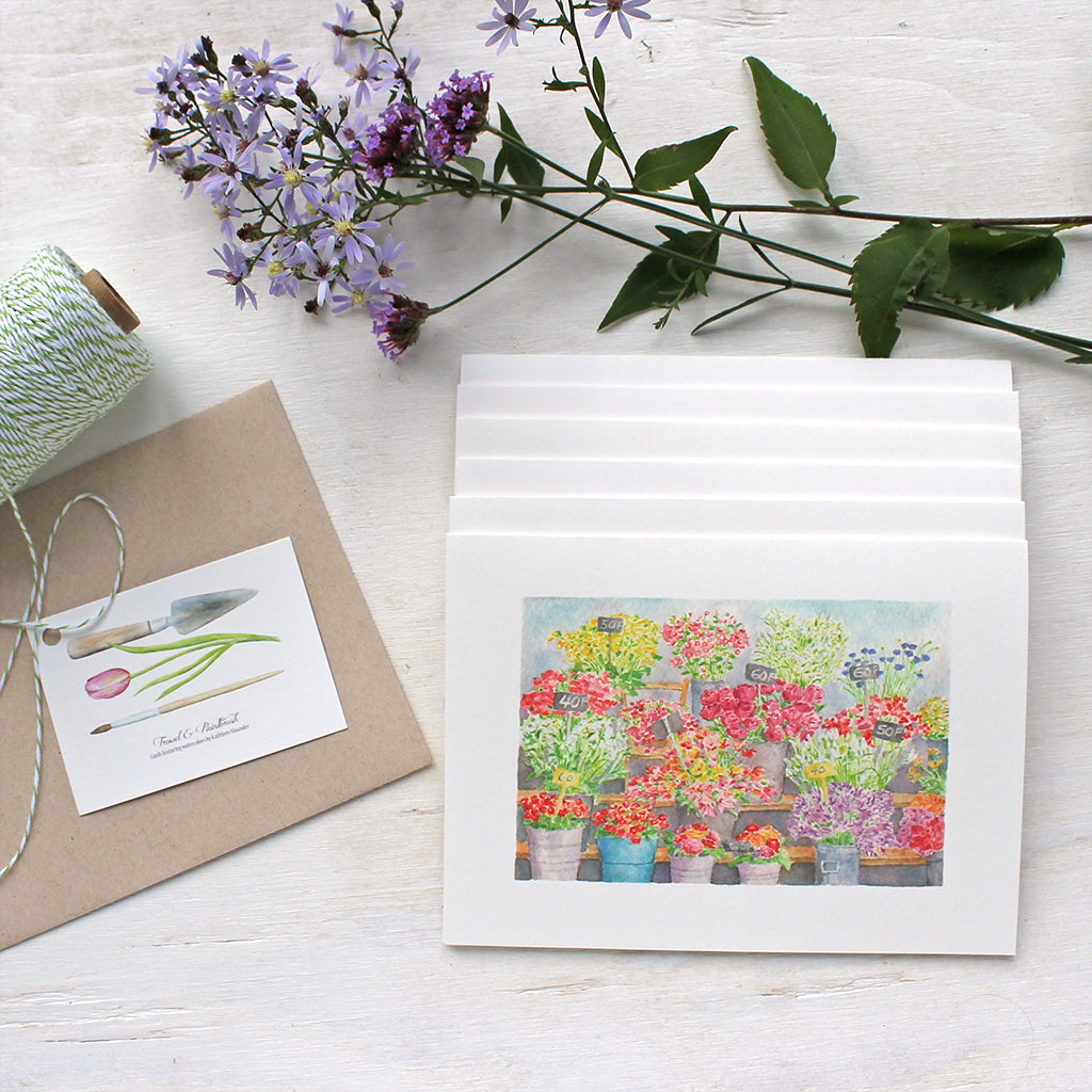 This beautiful set of five note cards features a watercolor painting of the flower market or 'marché aux fleurs' on Île de la Cité in Paris. Artist Kathleen Maunder.