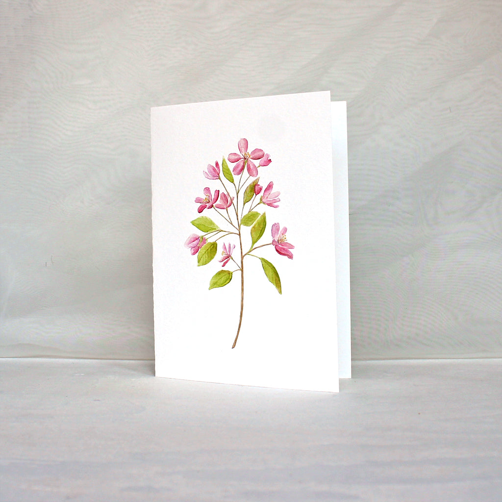 Note card with a pink crabapple branch painted in watercolor. Artist Kathleen Maunder