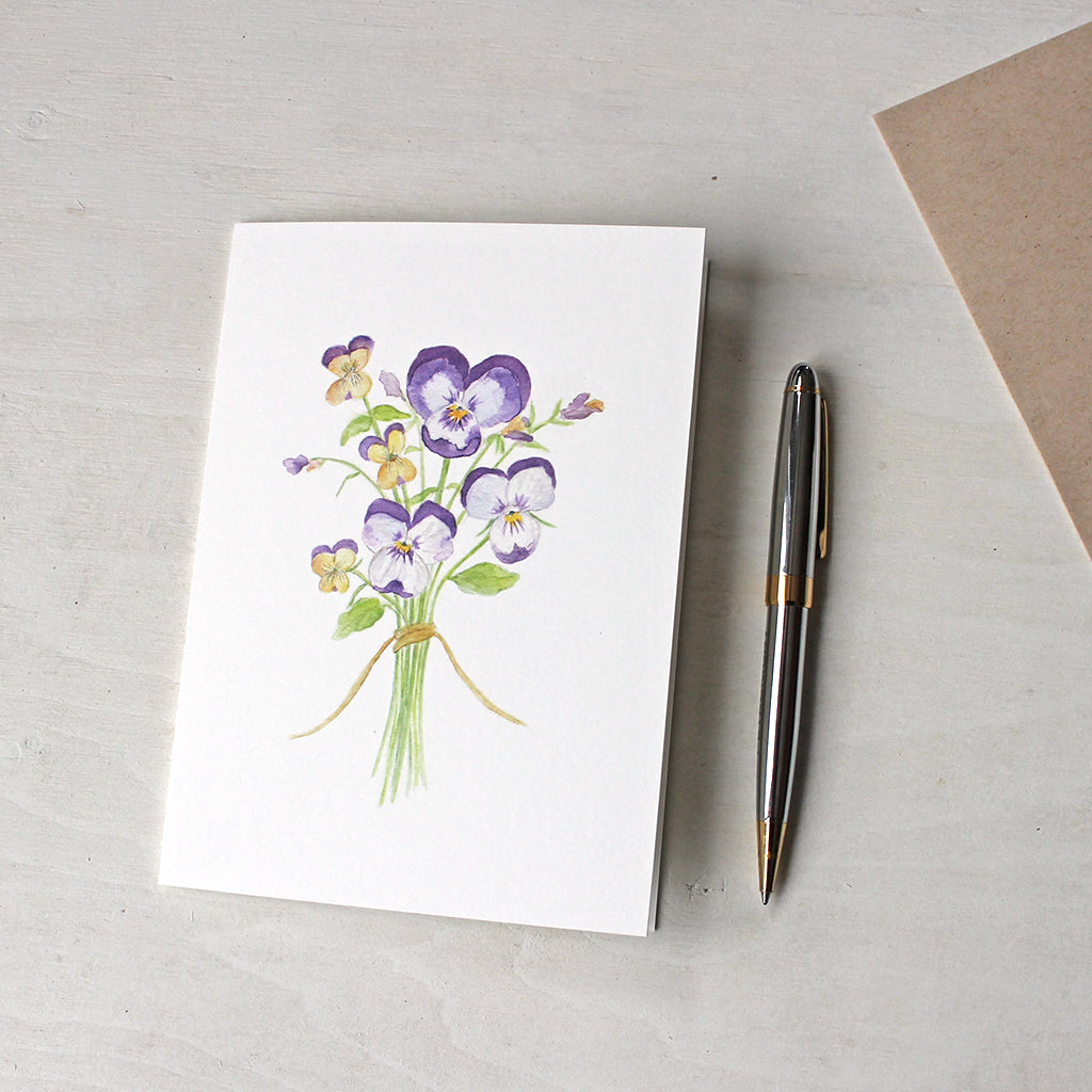 Note card featuring a watercolor painting of pansies and violas by Kathleen Maunder