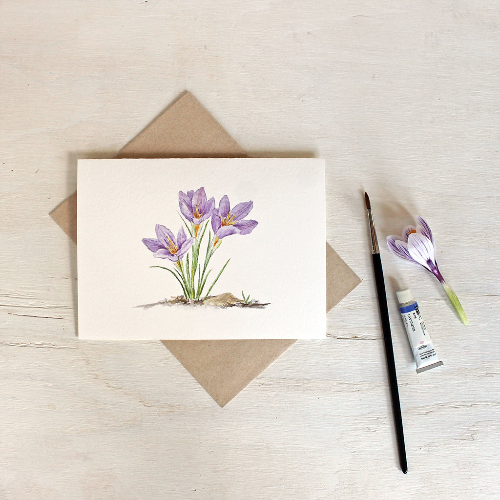 Note card featuring watercolor painting of three purple crocuses