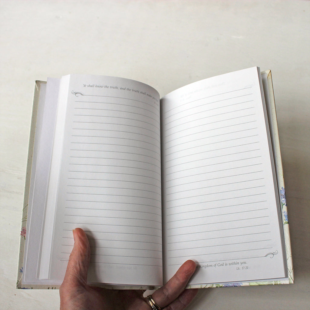 Inside pages of hardcover journal with Bible quotes.