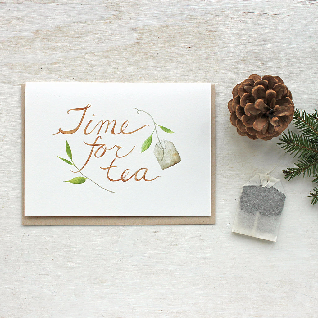 Tea note cards with a delicate watercolor painting of tea leaves, a tea bag and hand lettered 'Time for Tea' message. Artist Kathleen Maunder of Trowel and Paintbrush