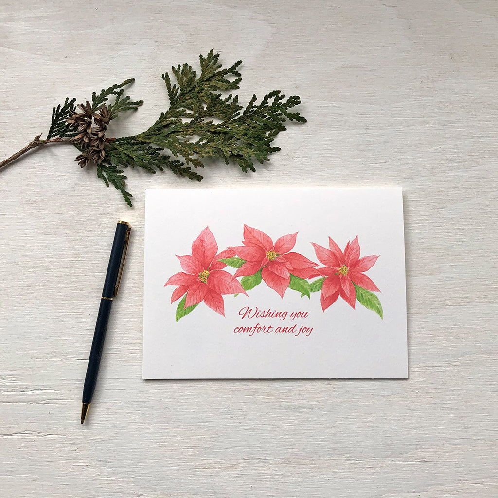 Red poinsettia Christmas card painted in watercolour by artist Kathleen Maunder