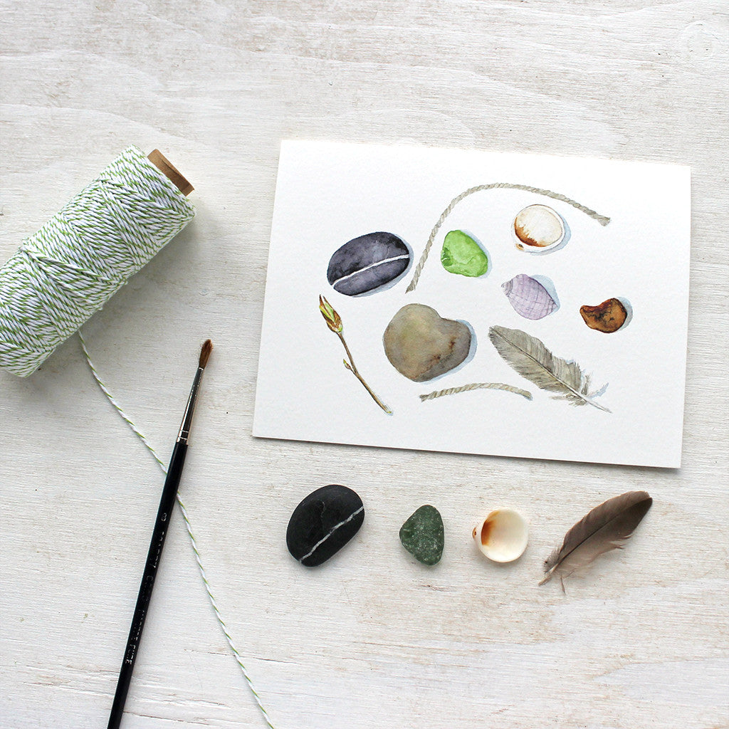 Beach collection note cards by watercolor artist Kathleen Maunder featuring shells, stones, a feather and sea glass.