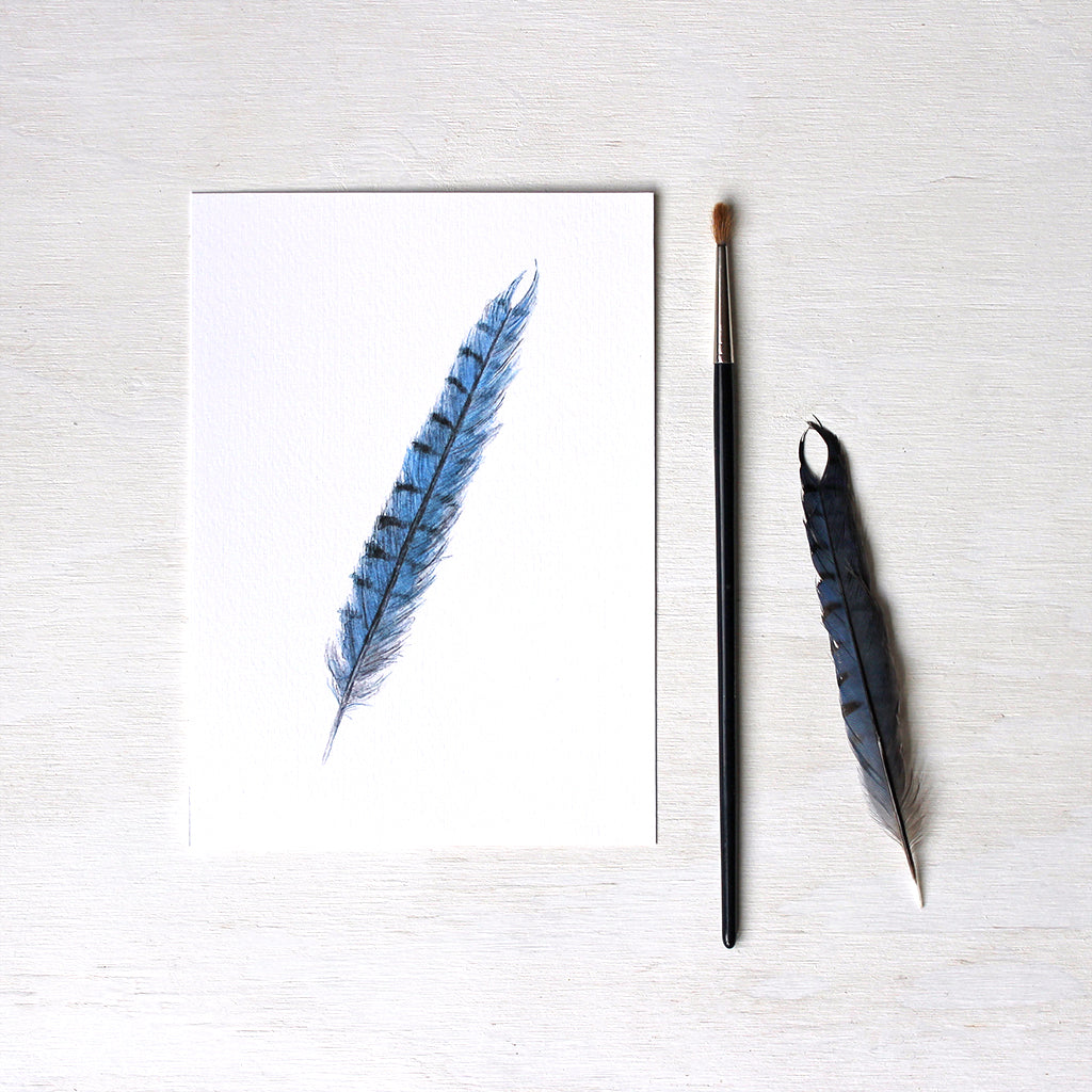 Art print featuring an original watercolor painting of a blue jay feather by Kathleen Maunder.