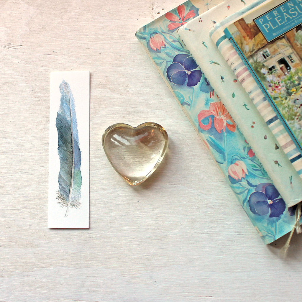 Blue feather bookmark featuring a watercolour by Kathleen Maunder