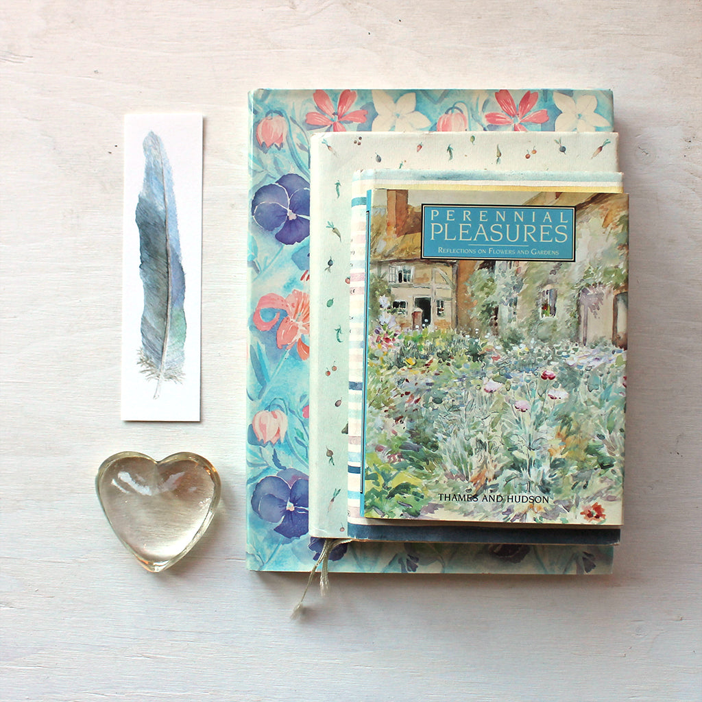 Paper bookmark by watercolor artist Kathleen Maunder featuring a parrot feather