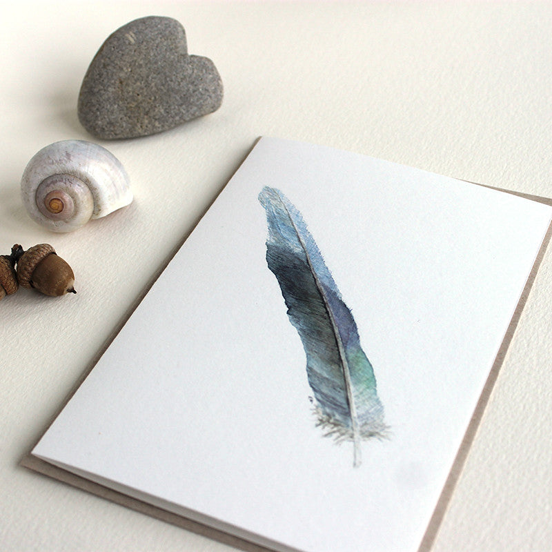 Note card featuring a watercolor painting of a parrot feather by Kathleen Maunder