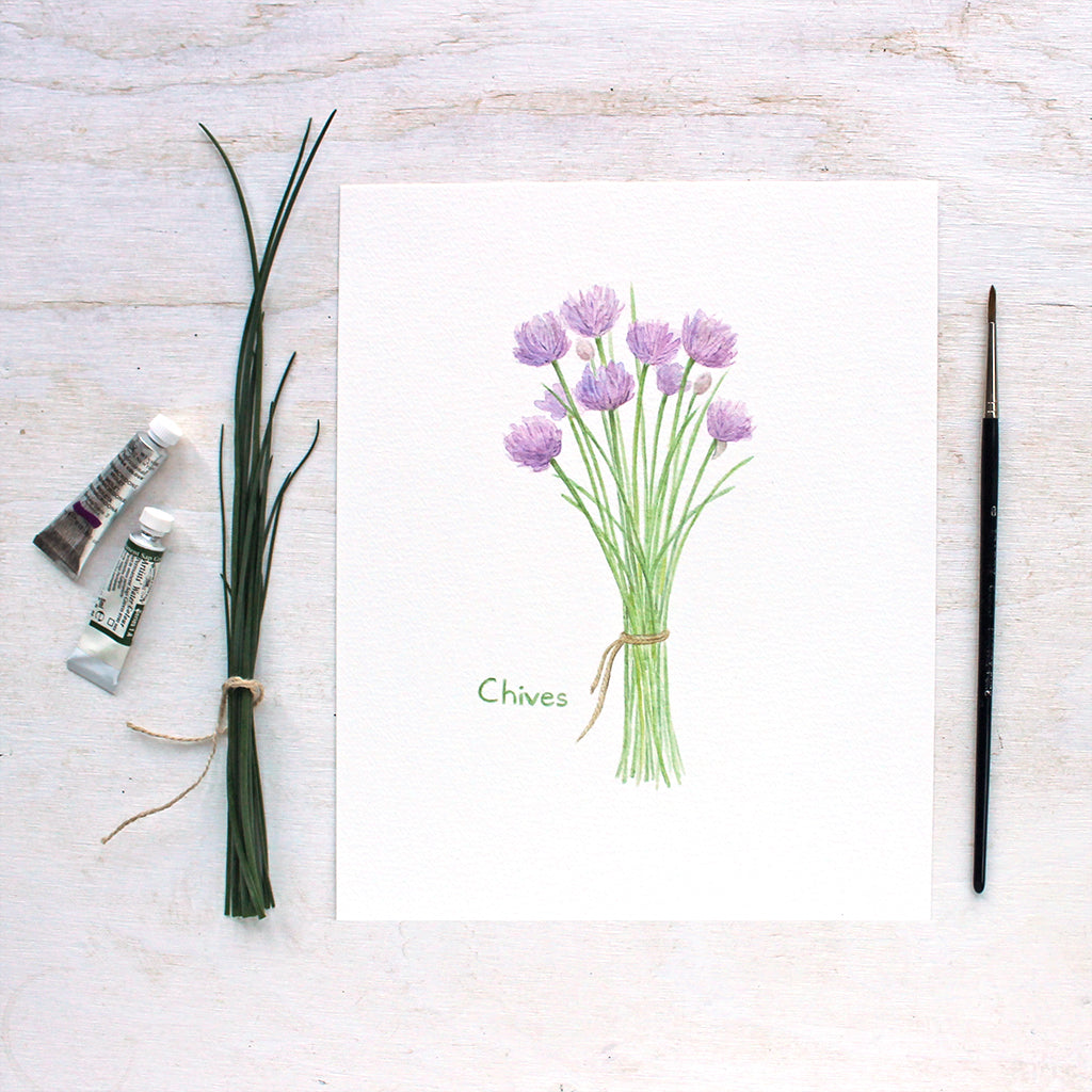 An art print featuring a watercolor painting of a bunch of chives tied with string. Artist Kathleen Maunder, Trowel and Paintbrush