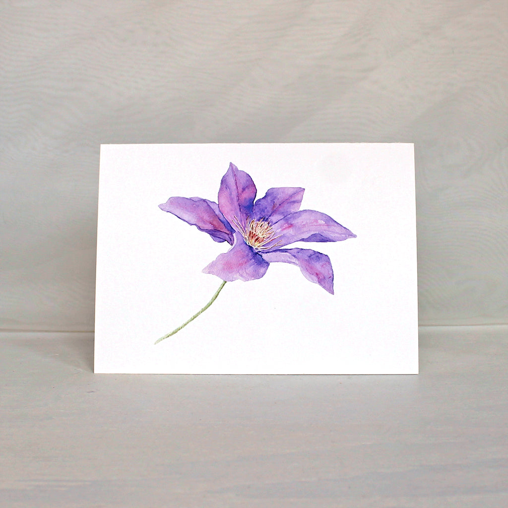 Purple clematis flower watercolor painting on a note card. Artist Kathleen Maunder.