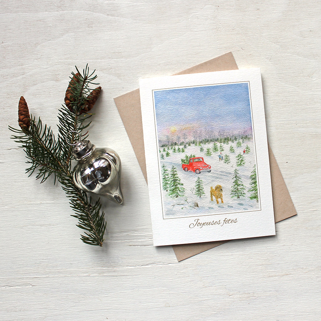 Carte de souhaits pour Noël mettant en vedette une aquarelle d'une ferme de sapins