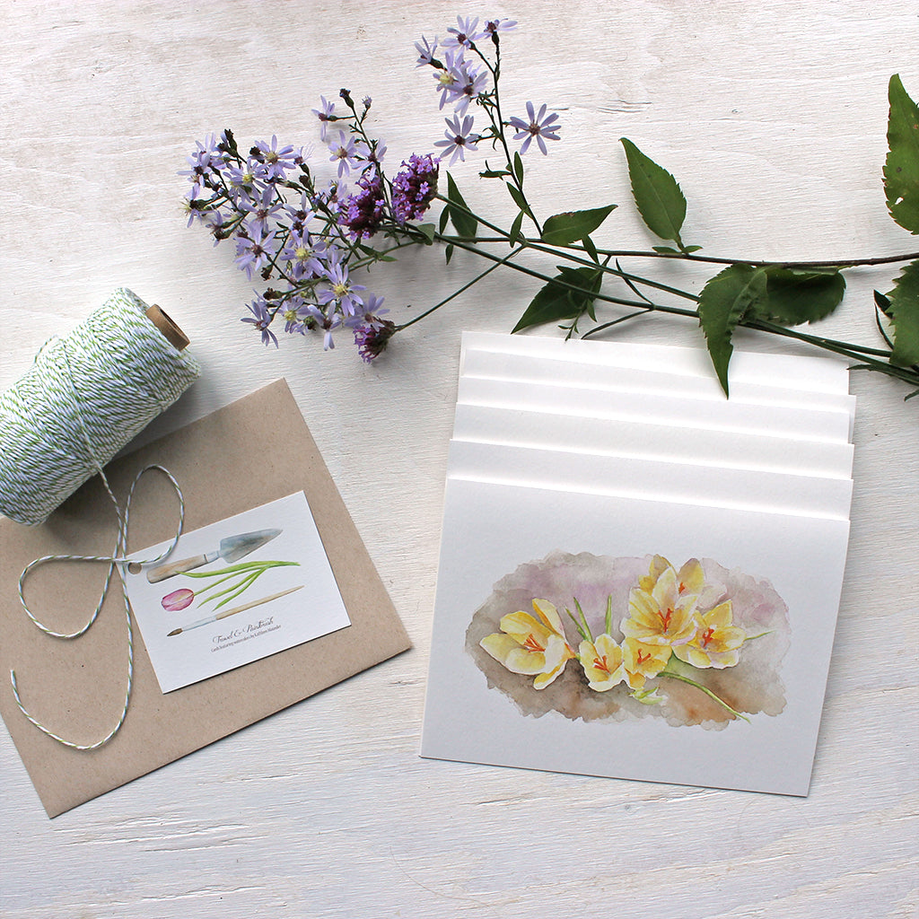 Set of note cards featuring a watercolor painting of yellow crocuses by Kathleen Maunder
