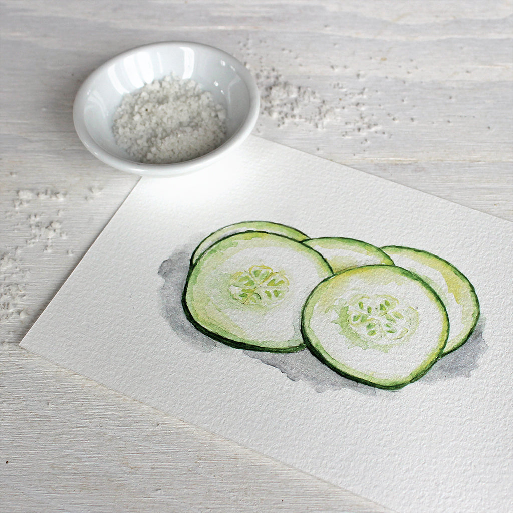 Art print of a watercolor painting of fresh cucumber slices. Artist Kathleen Maunder