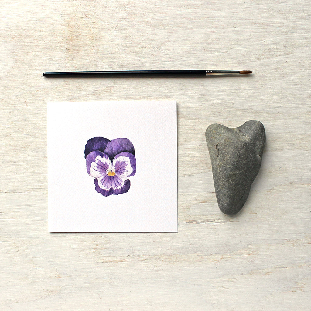 A lovely art print of a watercolor painting of a single dark purple pansy flower by artist Kathleen Maunder, trowelandpaintbrush