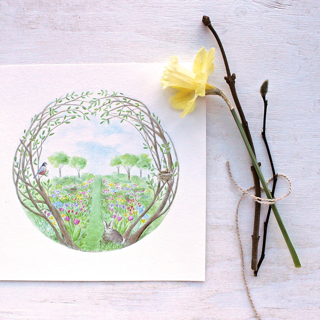 Secret Garden watercolor art print by artist Kathleen Maunder featuring a lovely curved tree, spring flowers, rabbits and birds