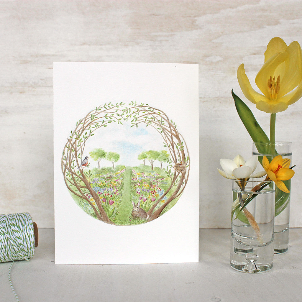 Secret Garden Note Card by watercolor artist Kathleen Maunder. A garden full of spring flowers, baby birds and bunnies.