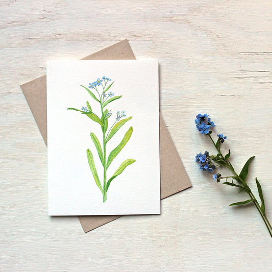 A note card featuring a beautiful painting of a forget me not flower stem. Watercolor artist Kathleen Maunder