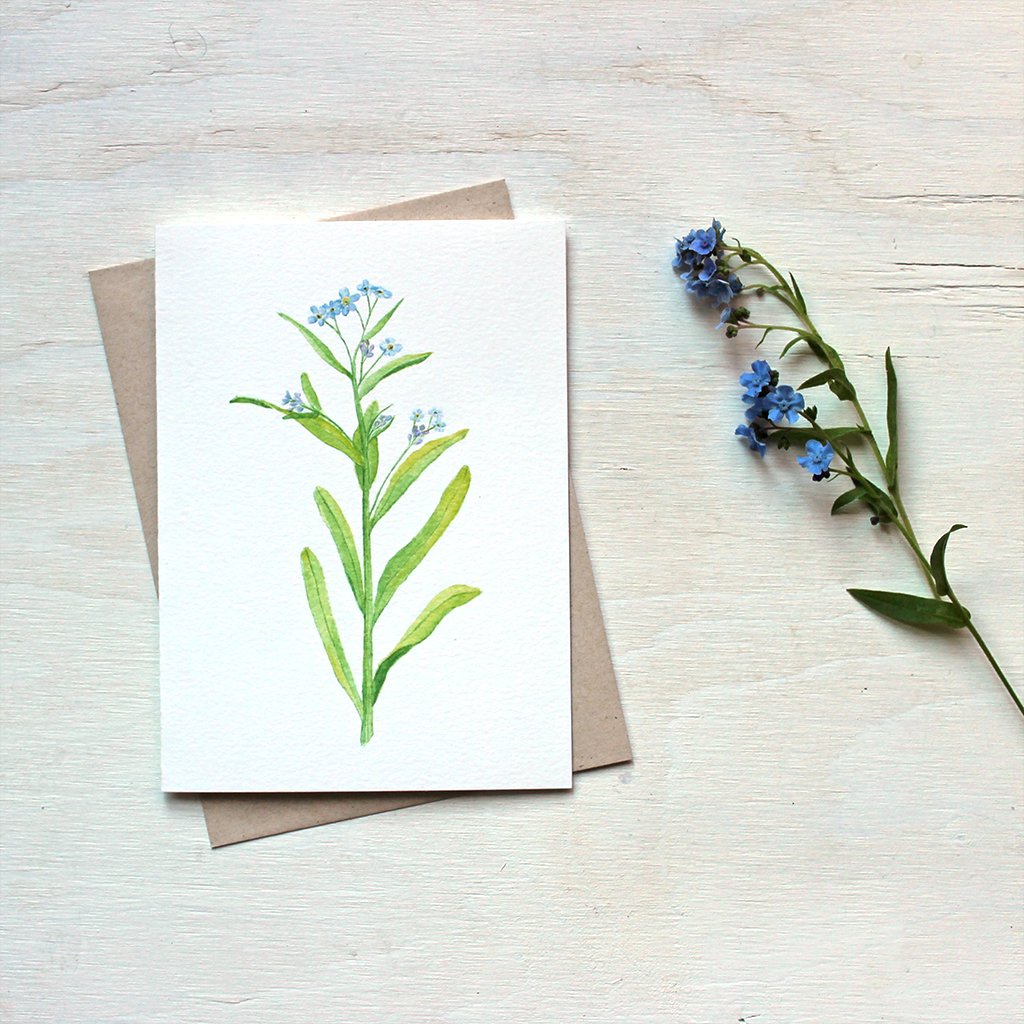 Watercolour painting of forget me nots on note card. Artist Kathleen Maunder.
