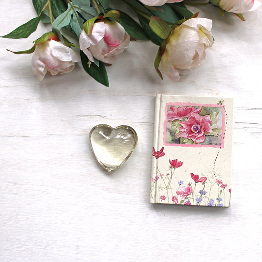 Vintage hardcover notebook with perforated ruled pages. The floral watercolor paintings on the cover are by Kathleen Maunder.