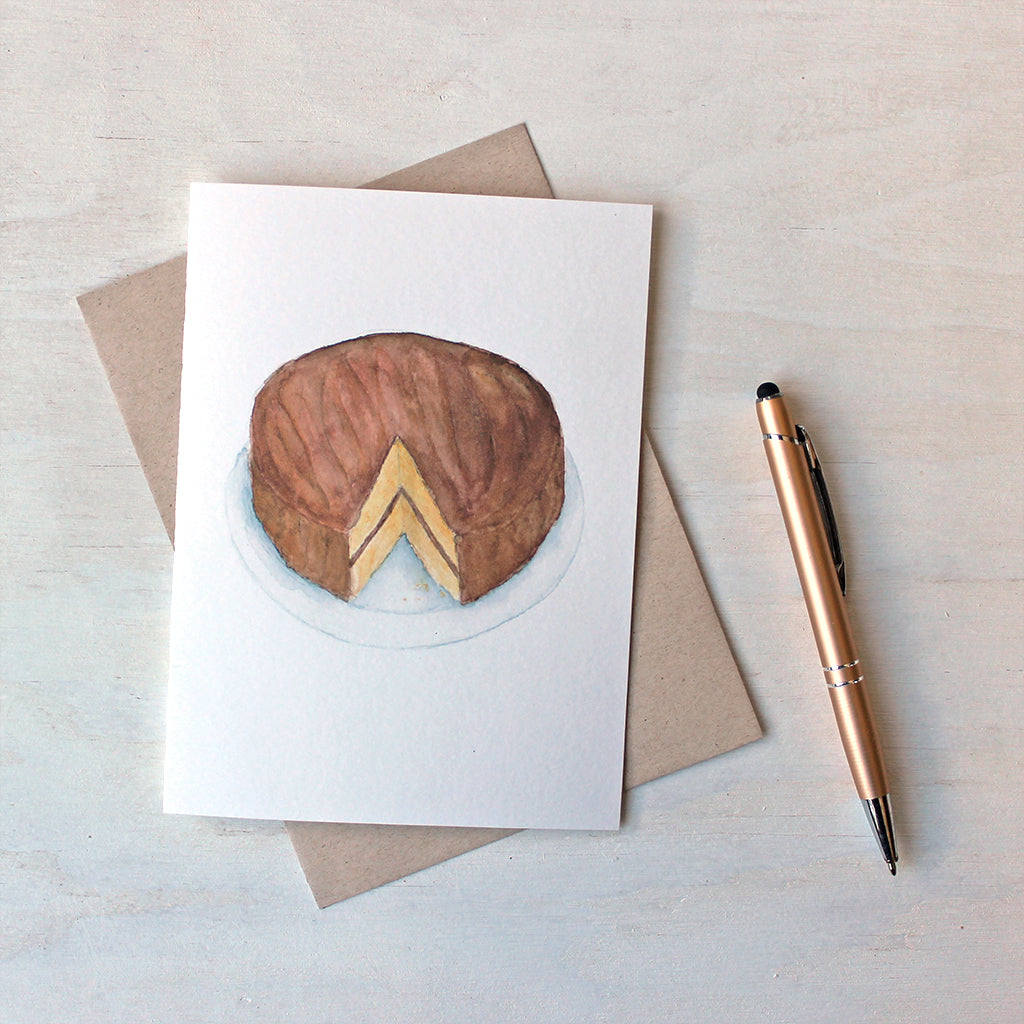 Note card featuring a watercolor painting of a layer cake. Artist Kathleen Maunder.
