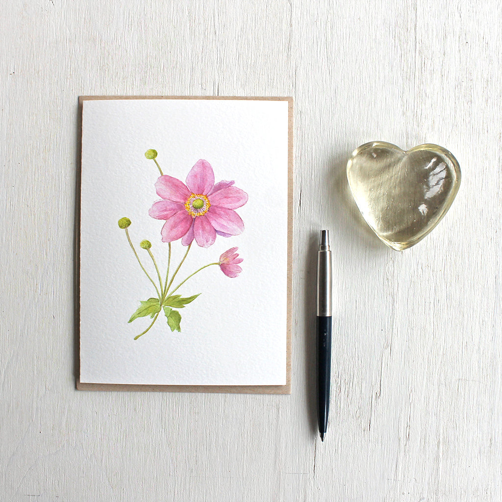 Note card featuring watercolor painting of pink Japanese anemone stem. Artist Kathleen Maunder.