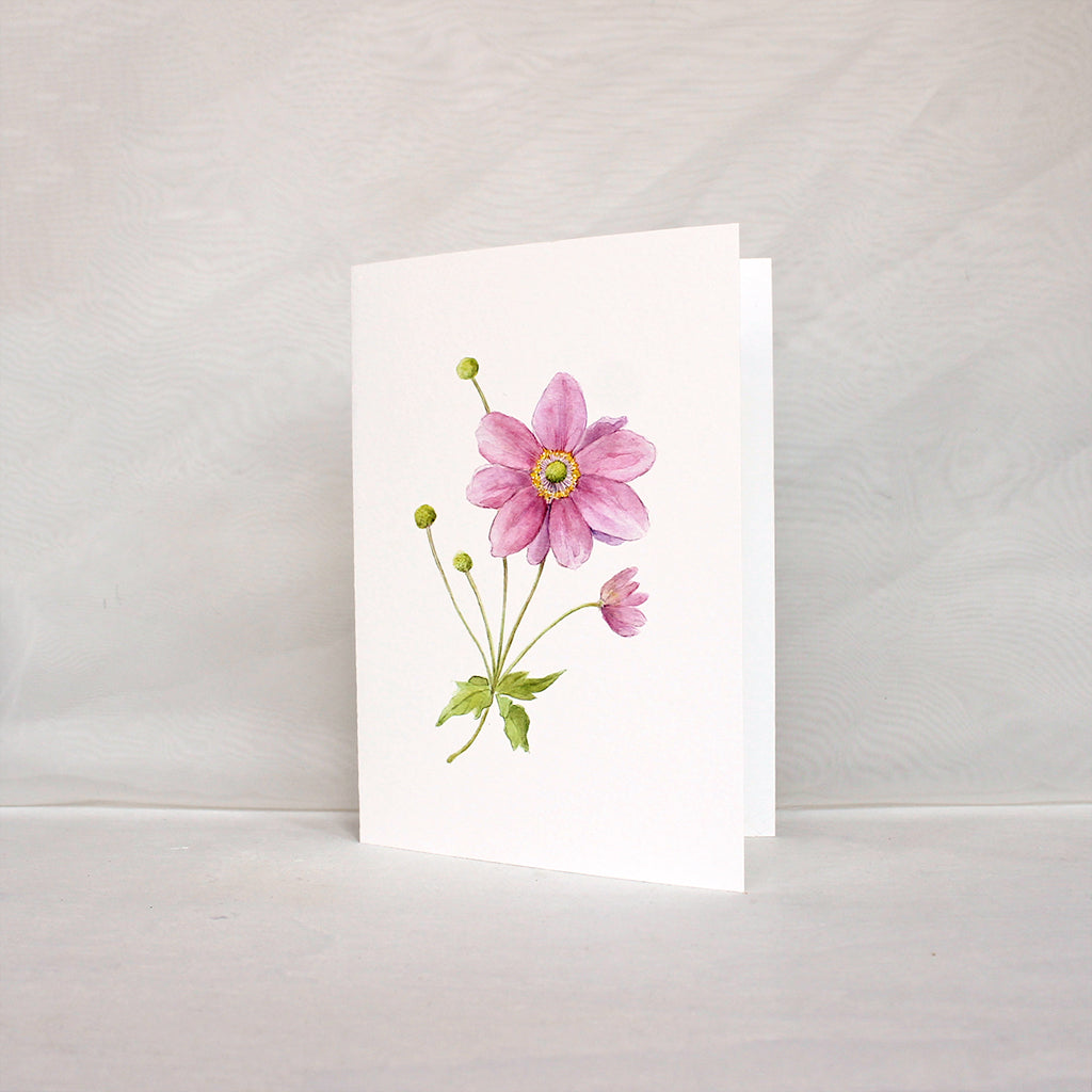 Note card featuring a pink Japanese anemone flower in watercolour. Artist Kathleen Maunder.