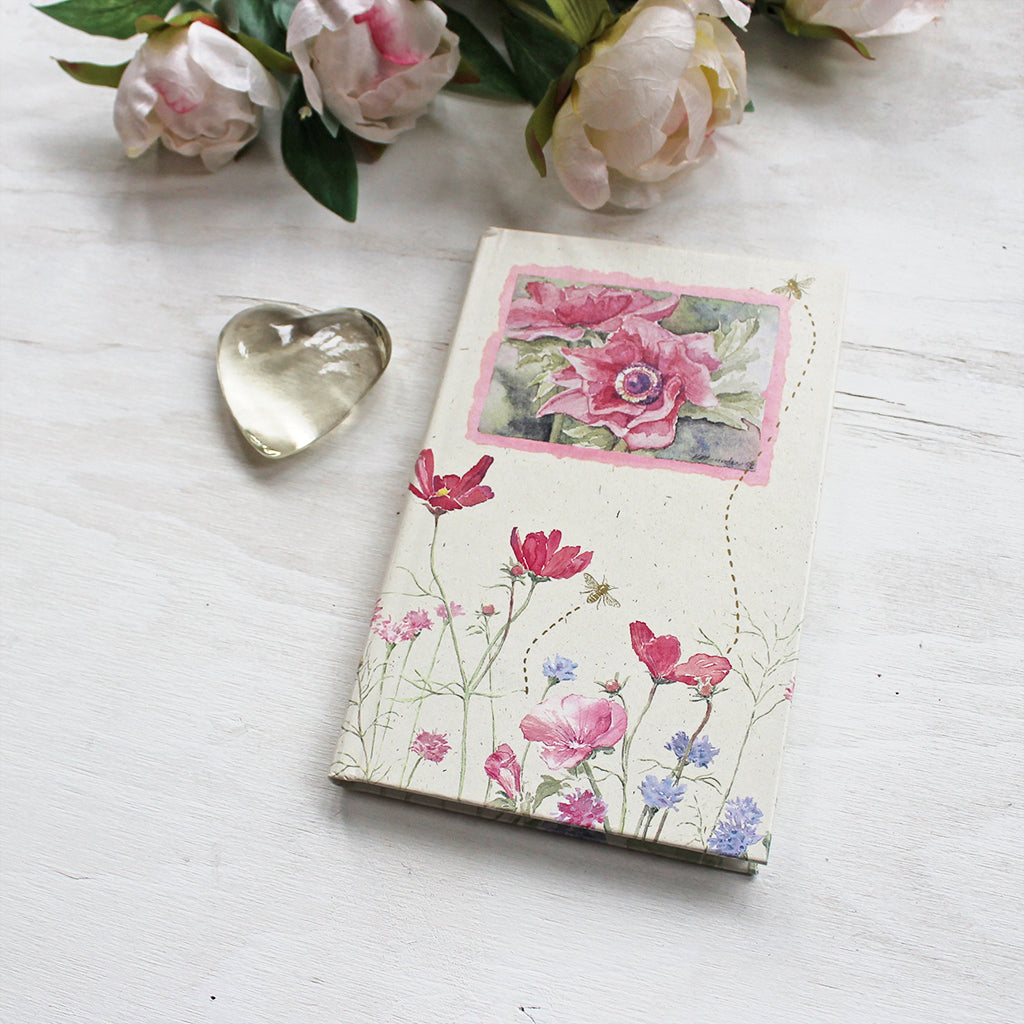 Vintage hardcover journal with ruled pages. The floral watercolor paintings on the cover are by Kathleen Maunder.