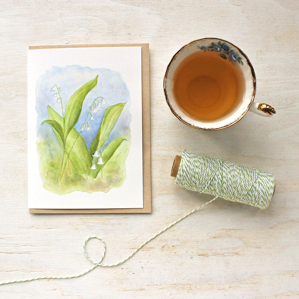 Blank note cards featuring a lily of the valley watercolor painting by Kathleen Maunder