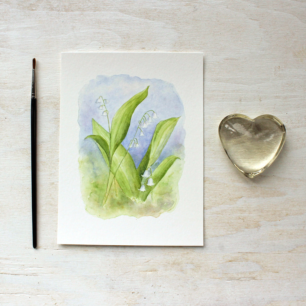 An art print of a delicate watercolor painting of lily of the valley by Kathleen Maunder.