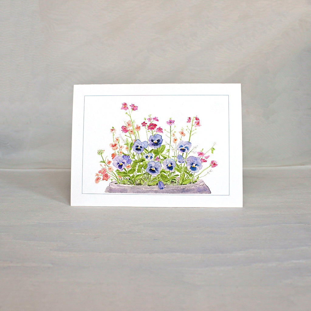 Note card featuring purple blue pansies in a pot. Watercolour painting by Kathleen Maunder