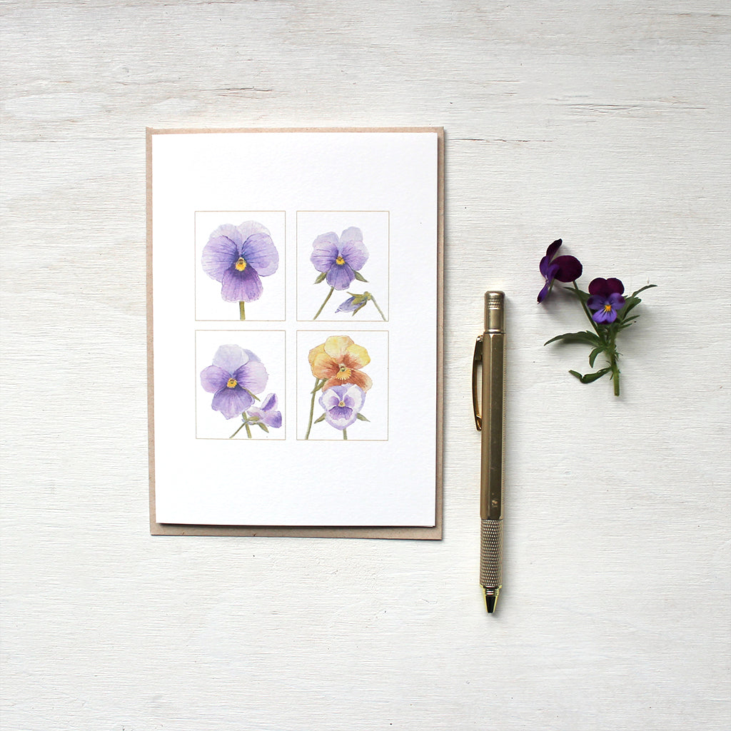 A quartet of pansy images painted in watercolour and featured on notecards. Artist Kathleen Maunder.