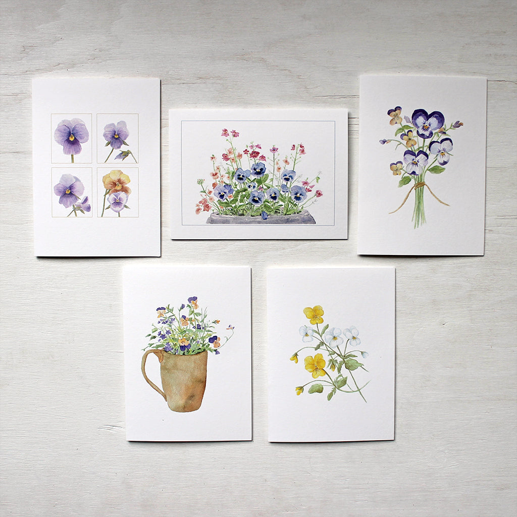 Five note cards depicting paintings of pansies and violas by watercolour artist Kathleen Maunder.