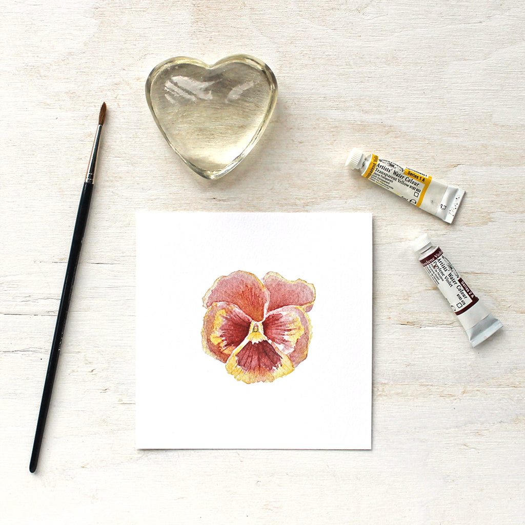 A watercolor art print of a rusty red pansy. Painting by artist Kathleen Maunder.