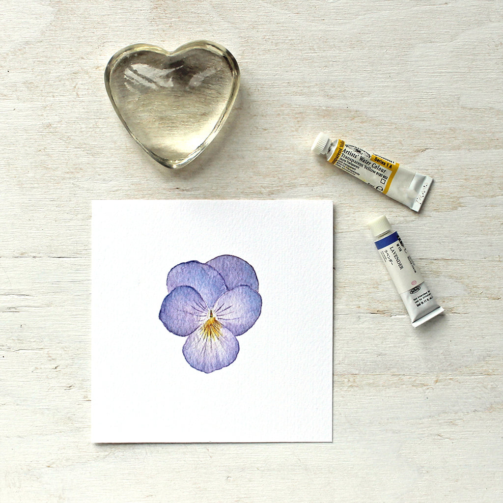 A watercolor art print of a lavender pansy. Artist Kathleen Maunder.