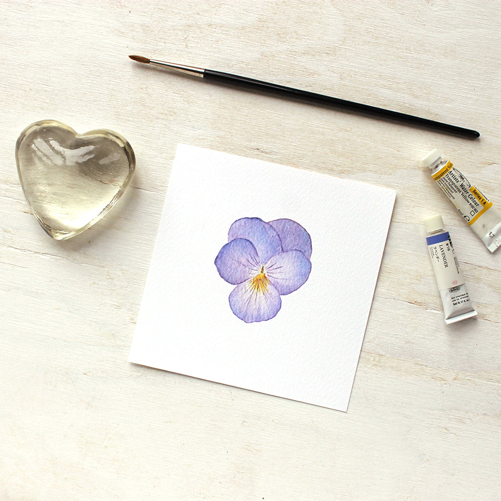 An art print of a watercolor painting of a lovely violet-colored pansy flower. Artist Kathleen Maunder.