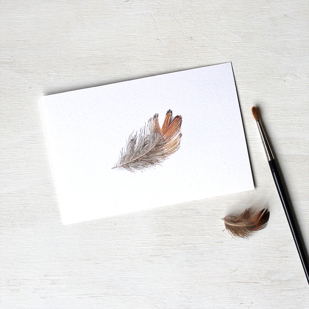 Print of a pheasant feather watercolor painting by Kathleen Maunder.