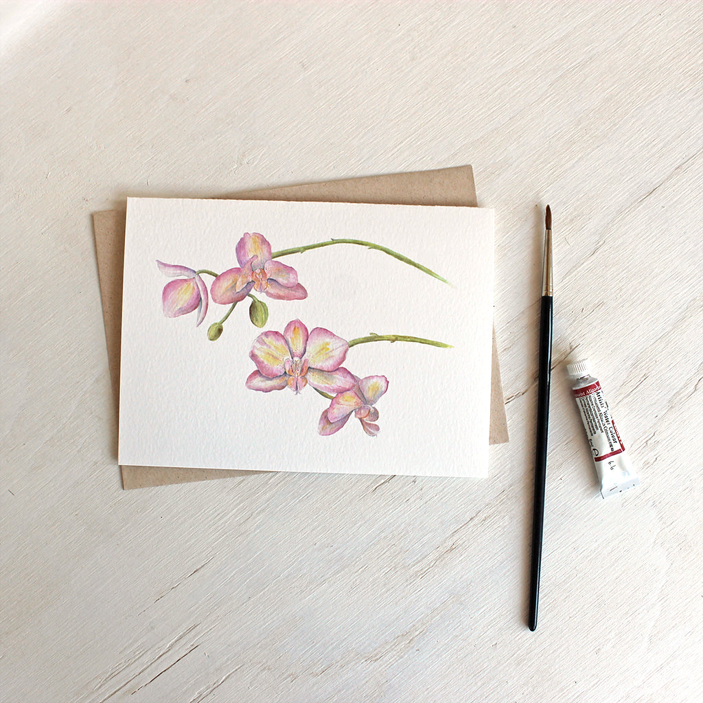 Pink and yellow orchids on note card by watercolor artist Kathleen Maunder