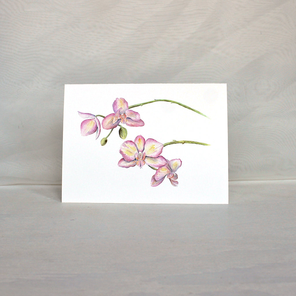 Note card featuring a watercolor painting of pink and yellow orchids.