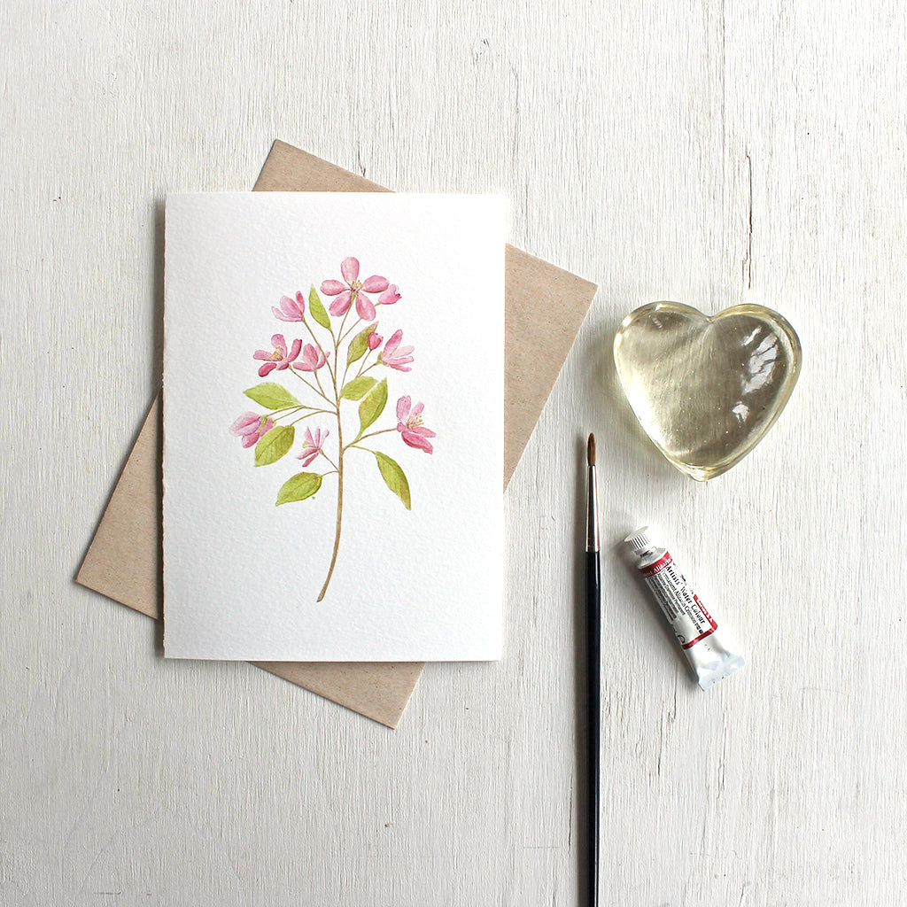 Note card featuring watercolor painting of pink crabapple blossoms. Artist Kathleen Maunder.