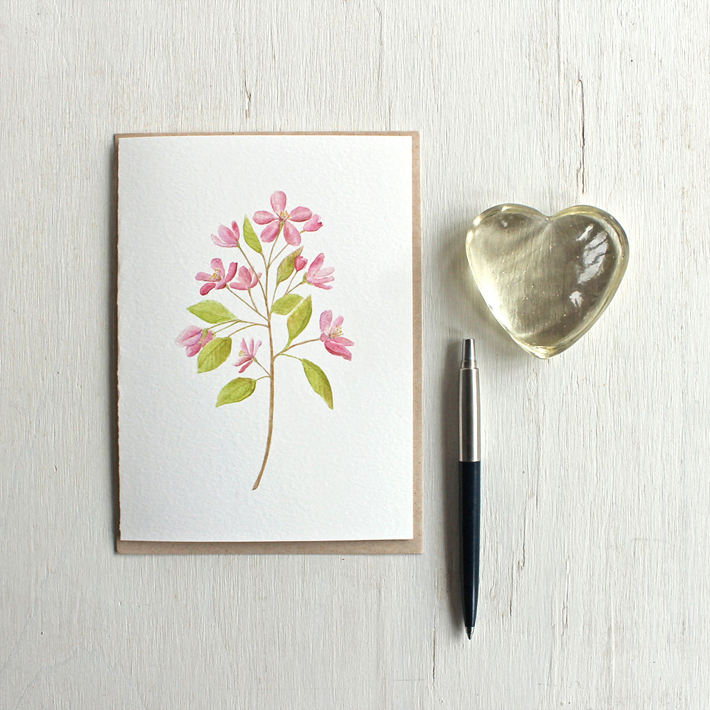 Note card with a pink crabapple branch painted in watercolor. Artist Kathleen Maunder