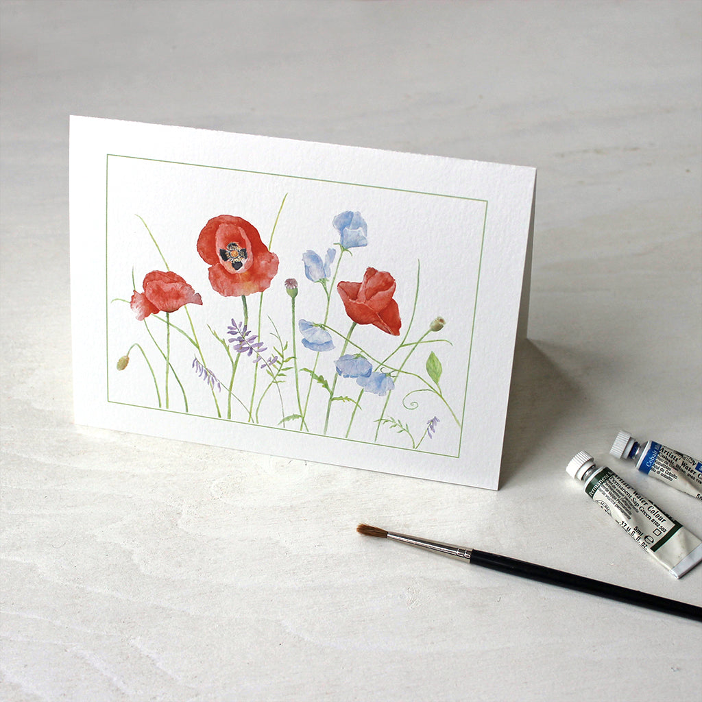 Note cards featuring a watercolor painting of red poppies and blue sweet peas by Kathleen Maunder