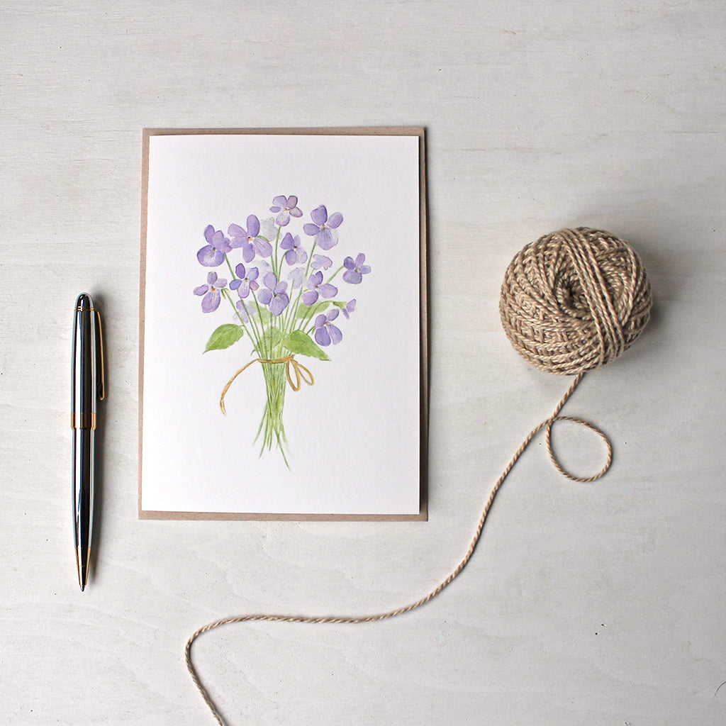 Note card featuring a watercolor painting of violets by Kathleen Maunder