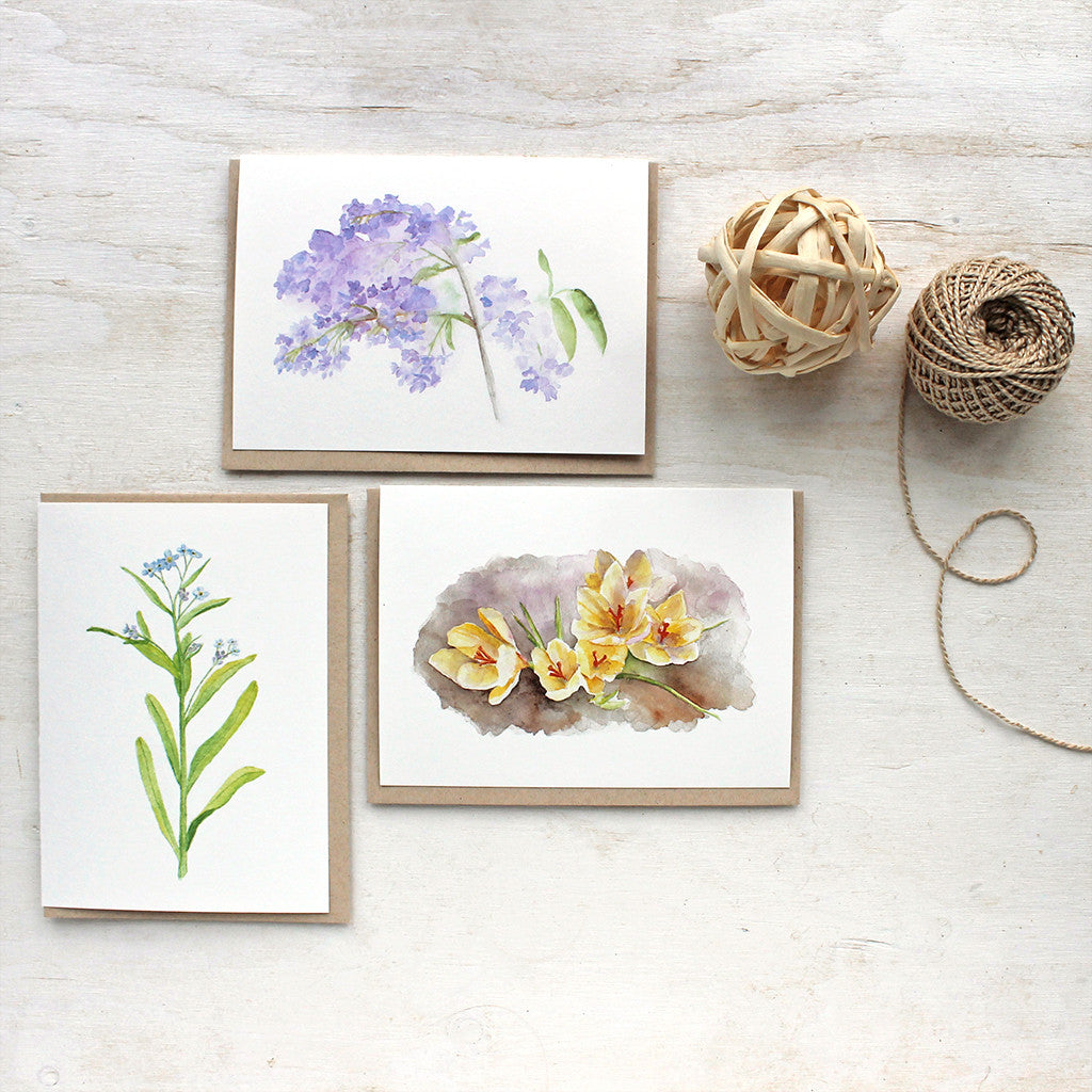 Spring flower watercolor cards by Kathleen Maunder of Trowel and Paintbrush. Featuring lilacs, crocuses and forget-me-nots.