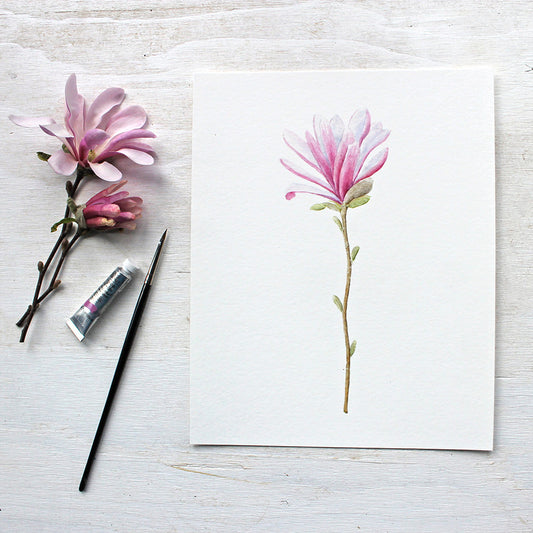 An art print featuring a botanical watercolor painting of a pink star magnolia flower by Kathleen Maunder