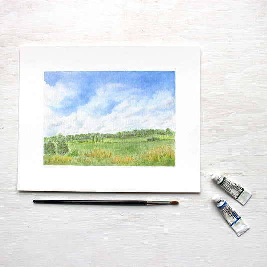 Rural landscape watercolor painting - 8 x 10 print of 'Summer Day' by Kathleen Maunder. A painting of a rolling green field, a barn in the distance and a lovely cloud filled summer sky.