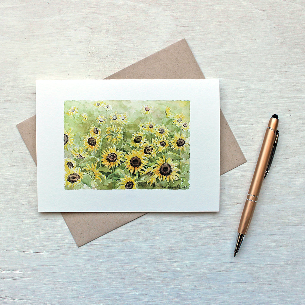 Note card featuring a watercolor painting of a sunflower field by Kathleen Maunder