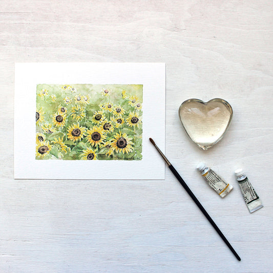 A beautiful art print featuring a watercolor painting of a sunflower field. Artist Kathleen Maunder.